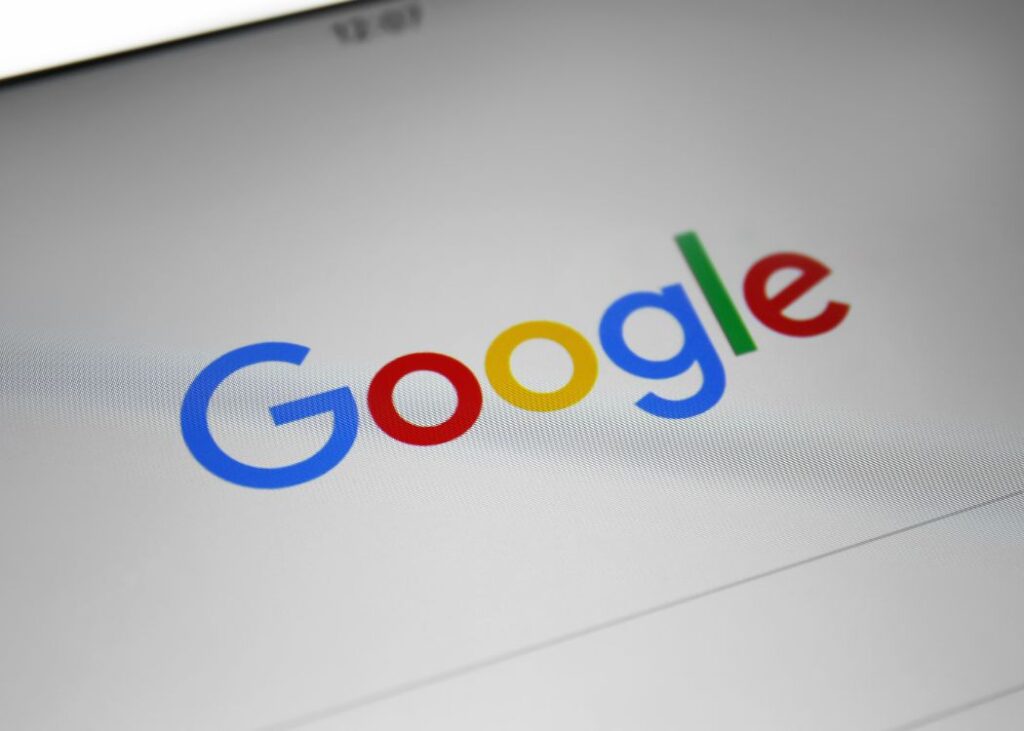 Close-up of Google logo on a digital screen.