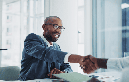 Businessman shaking hands in office meeting