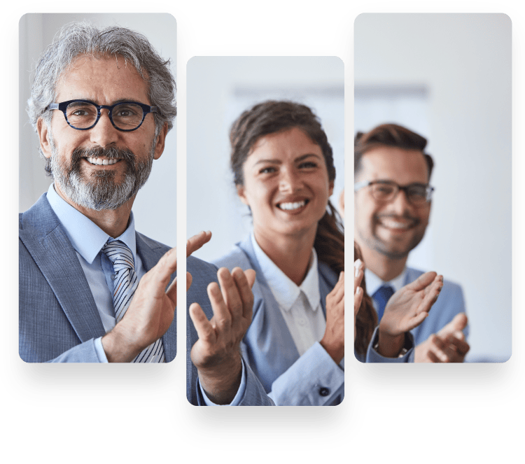 Three professionals clapping and smiling in office.