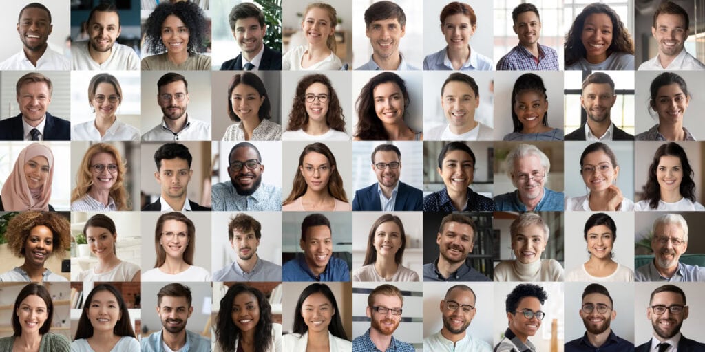 Diverse group of smiling people in professional attire.