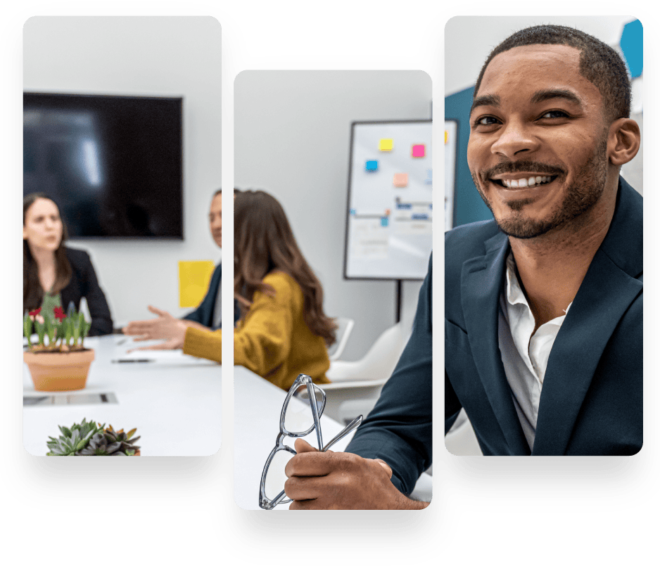 Business professionals discussing and smiling in a modern office.