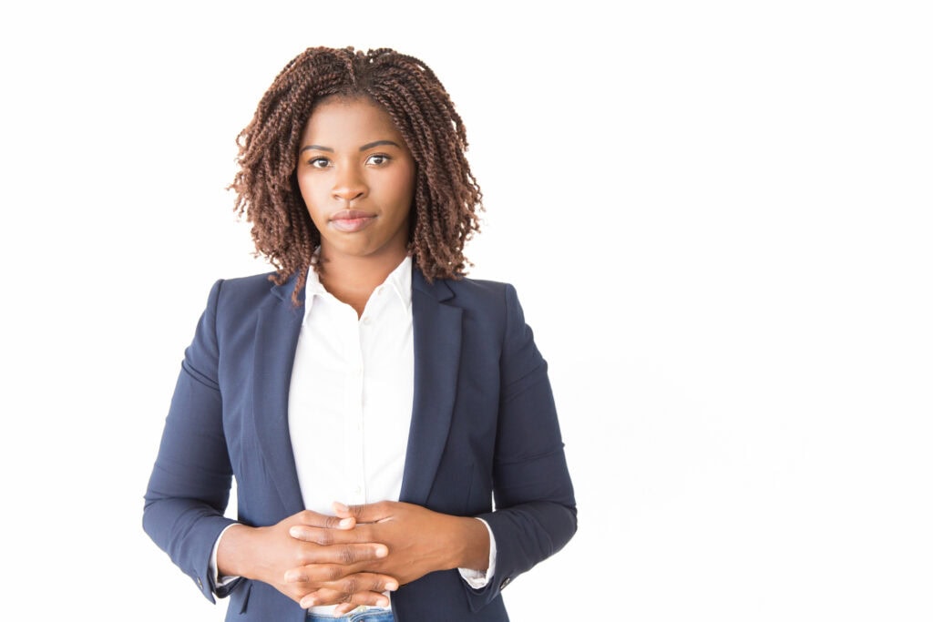 Confident businesswoman in professional attire, isolated on white