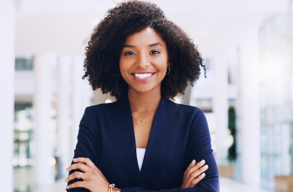 Confident businesswoman smiling in office