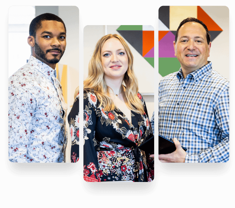 Three professionals smiling in modern office setting