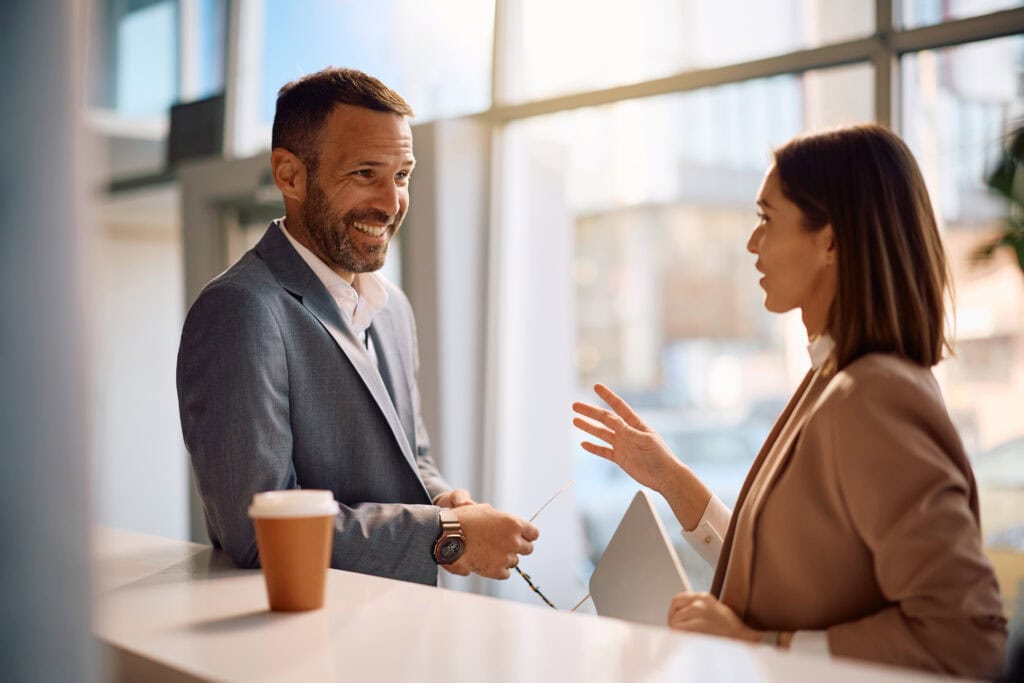 Professionals discussing over documents in office