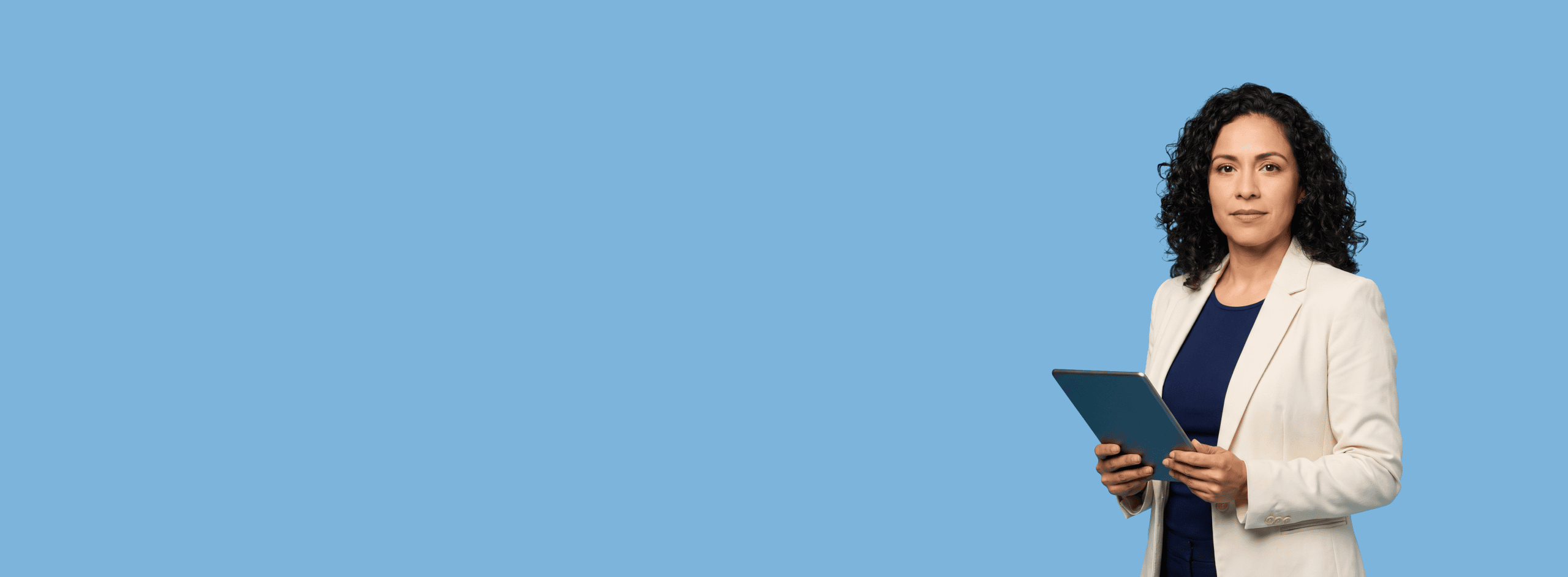 Latina female attorney, 30s to 40s, average build in cream blazer with navy shell top, portrait against a light blue background - Google AI Overviews Are Changing How Clients Find Lawyers. Here’s What to Do About It.