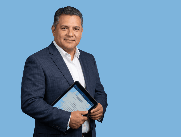 Latino male attorney, 40s to 50s, stocky build in navy suit with no tie - “I Felt Like I Already Knew Who I Was Hiring”