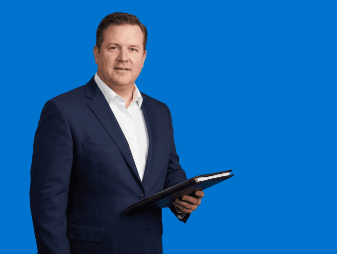 white male attorney, plus-size, late 40s in tailored navy suit with open-collar white shirt - Why Law Firm Google Ads Fail 82% of the Time And What Works Instead