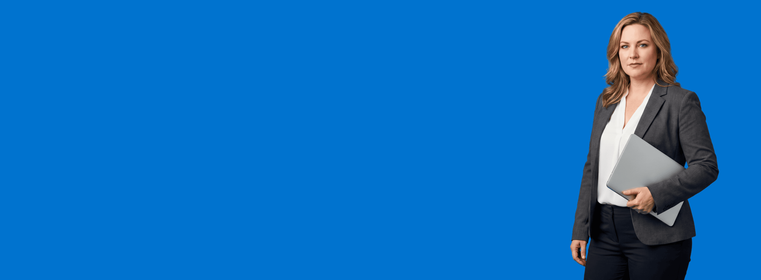 white female attorney, 40s, curvy build in charcoal blazer over white shell with tailored trousers, portrait against a saturated blue background - Law Firm Content Marketing