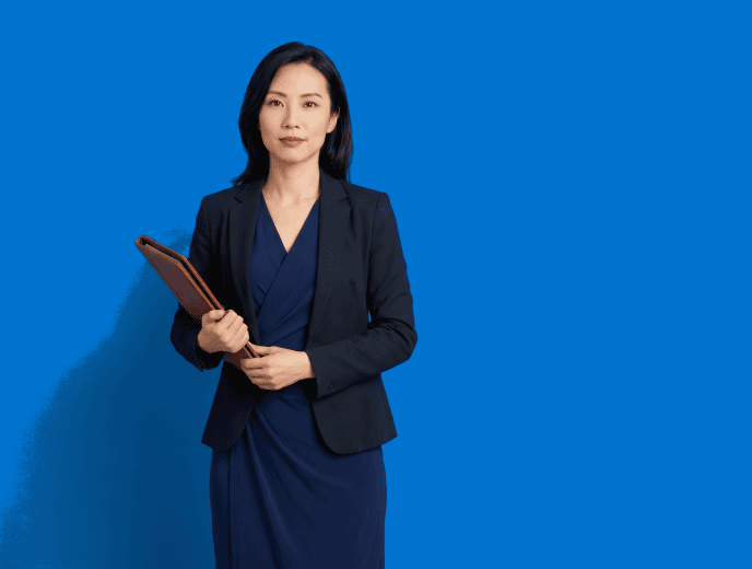 Asian female attorney, 30s, slim build in navy wrap dress with structured blazer - The $500K Law Firm Owner’s Marketing Audit