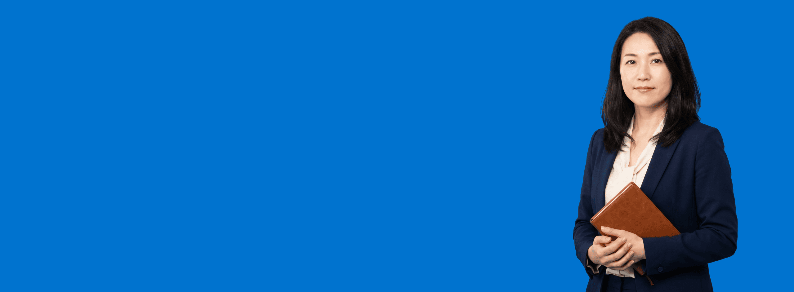 Asian female attorney, 40s, average build in navy blazer with cream blouse, portrait against a saturated blue background - Forward Push vs. Rankings.io